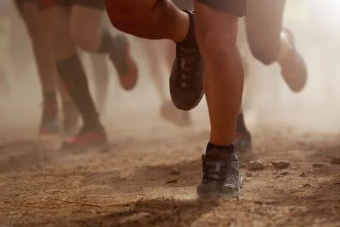 Trail running group on mountain path exercising Stock Photos