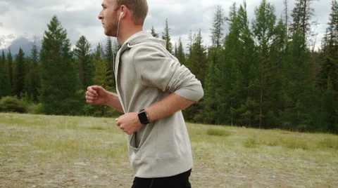 Trail running man on mountain path exercising Stock Footage 65484025