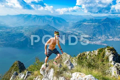 Trail running in the mountains man athlete shirtless Stock Photos