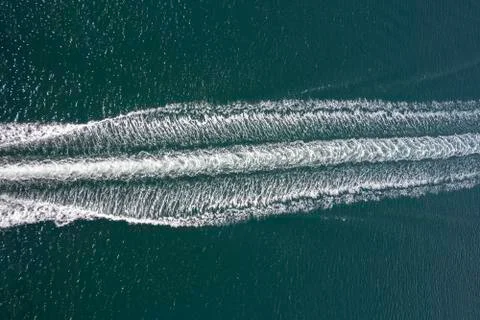 Trail on sea surface Stock Photos