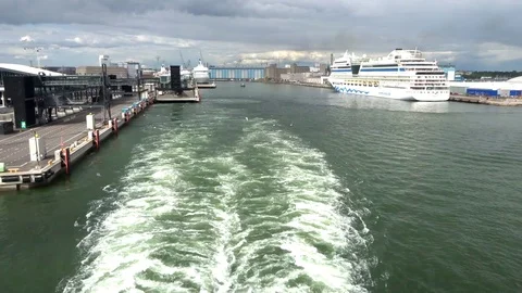 Trail of the ship (ship wake ) against the backdrop of the port of Helsinki Stock Footage 95431982