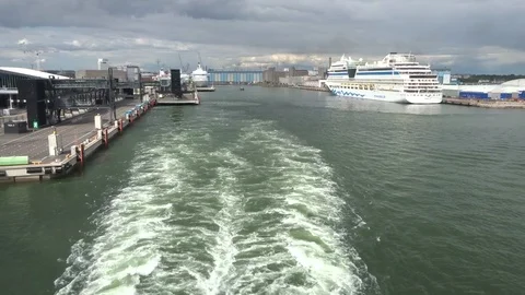 Trail of the ship (ship wake ) against the backdrop of the port of Helsinki Stock Footage 109546644