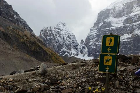 Trail sign that marks two paths, one path for hikers and another for horses. Stock Photos