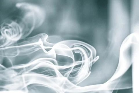 Trail of smoke on a dark background - creative colour effects with smoke smud Stock Photos