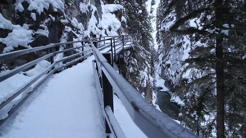 A trail on a snowy bridge in Alberta Stock Footage 90839215