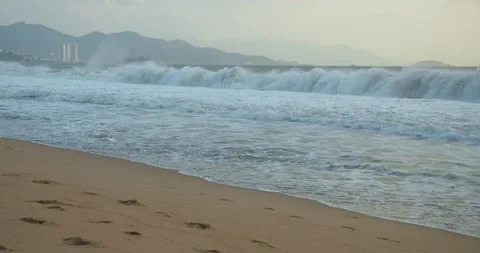 The trail of the sun on the waves in the sand. A large sun appears from behind Stock Footage 147054465