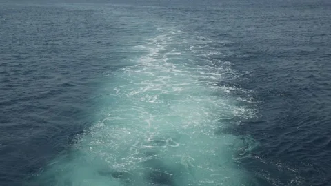 Trail on the water behind a moving ship. The work of the ship's engines. Stock-Footage 161567166