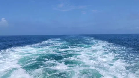 Trail on water surface behind of fast moving or sailing ship or boat Stock Footage 168568506
