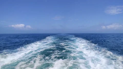 Trail on water surface behind of fast moving or sailing ship or boat Stock Footage 168568516