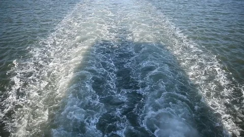 Trail on the waves from a floating ship Stock Footage 101726554