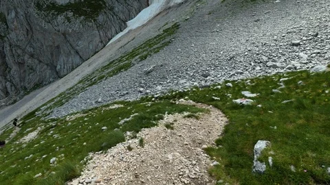 Trail winds through alpine meadow and rocky slope. Savin Kuk peak, Montenegro 스톡 동영상 342980058