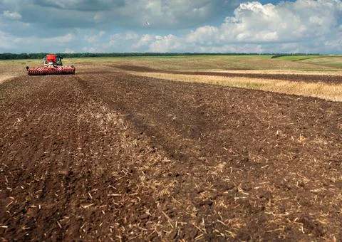 The trailed sowing complex sows seeds and separately applies  fertilizers Stock Photos