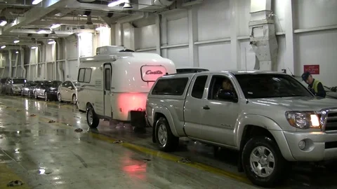 Trailer being backed in to parking space on Alaskan ferry. Stock Footage 79416703