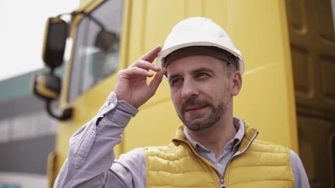 Trailer driver with hard hat and safety vest. Close up portrait of worker Stock Footage 111485186