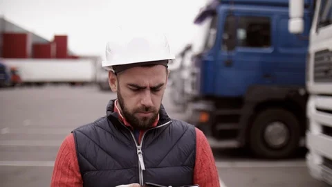 Trailer driver with hard hat and safety vest. Close up portrait of worker Stock Footage 111487384