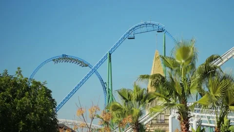 A trailer with people makes a dead loop on a roller coaster ride Stock Footage 229795596