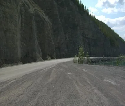Trailers drive by on mountain road Video stock 21828572