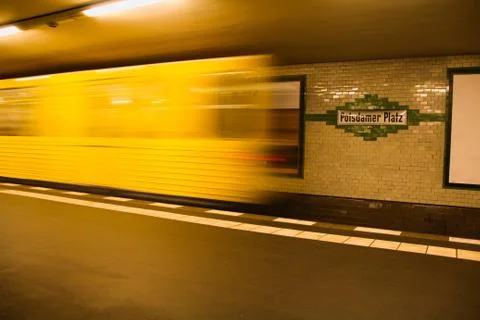 Trailing lights of a moving train in Potsdamer Platz, Berlin Stock Photos