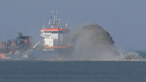 Trailing suction hopper dredger rainbowing at North Sea coast zoom out/in Stock Footage 36864023