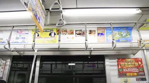 Train ads on inside of moving train - Tokyo Japan Video stock 58960837