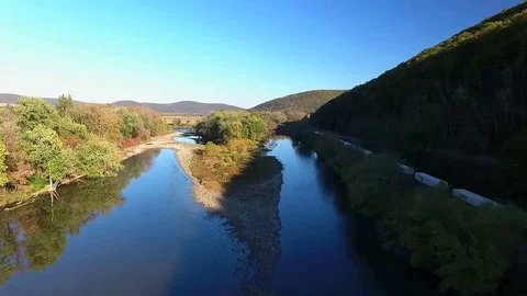 Train along river Stock-Footage 84625092