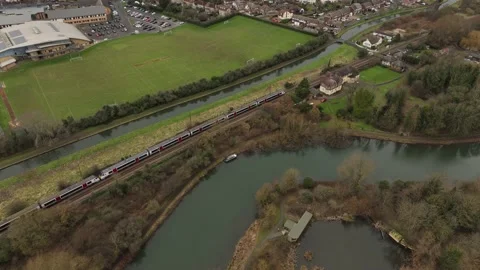 Train alongside river drone shot Stock Footage 231862181