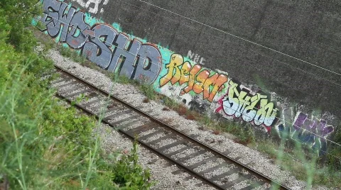 Train and  Grafitti Wall Stock Footage 753455