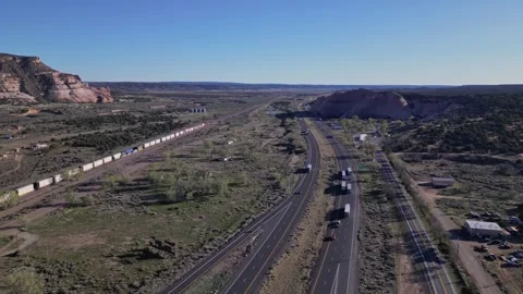 Train and highway road through the canyons in Arizona Stock Footage 241942866