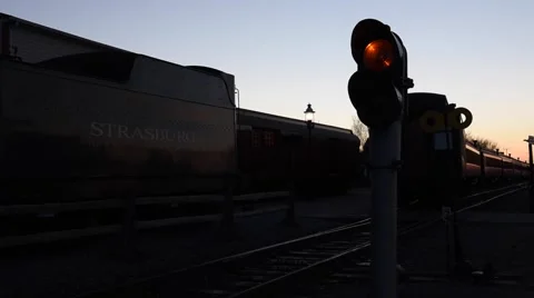 Train and Signal Light at Dusk Stock Footage 45252826