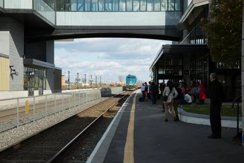 Train approaches station Stock Photos