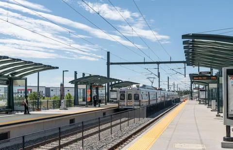 Train Approaching 40th Ave and Airport Boulevard Gateway Park Station on the RTD Stock Photos