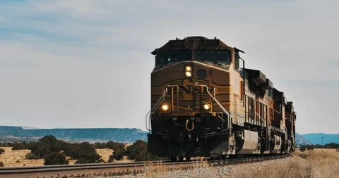 Train approaching camera in desert Stock Footage 87624207
