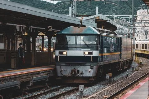 Train approaching central station. Shot in japan. Stock Photos