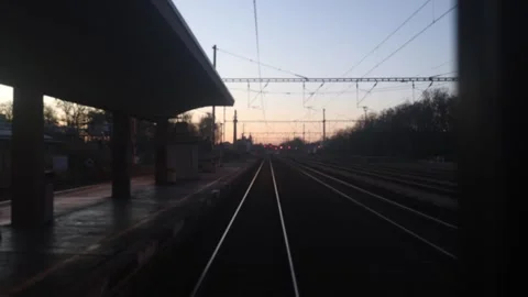 Train approaching dusk station Stock Footage 332620271