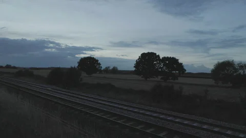 Train approaching in the evening light Stock Footage 221483283