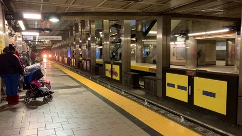Train approaching at North Station, a boston MBTA orange line train station i Stock-Footage 128198836