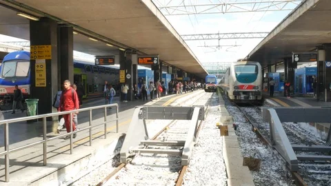 Train approaching platform and passengers at Roma Termini Railway Station Stock Footage 91837676