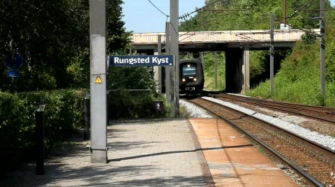 Train approaching railway station Stock Footage