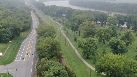 Train approaching a small town Stock Footage 114751599