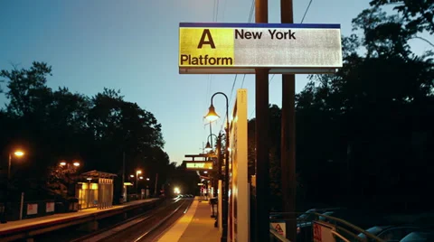 Train approaching station in evening (2 of 2) Video stock 32302283