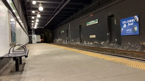 Train approaching at Symphony Station, a boston MBTA green line train station Stock Footage 128204843