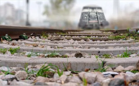 Train approaching on the track. Low point of view. Stock Photos