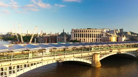 Train approaching train station located on roofed Blackfriars Railway Bridge Stock-Footage 157442232