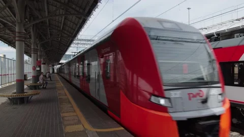 Train arrival. A new high-speed train arrives on the platform, which connects Stock Footage 195104577