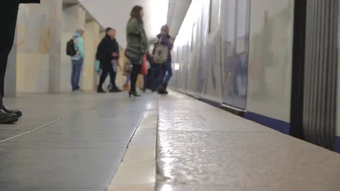 Train arrived on platform. Doors opened and passengers leave and enter car Stock-Footage 77010706