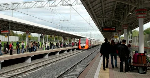 The train arrived on the platform, many passengers at the station Stock Footage 67470009