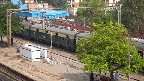 Train arrived at the station. Passengers on the platform, Delhi, India Stock Footage 99533000