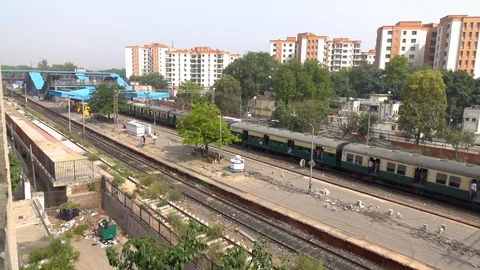 Train arrived at the station. Passengers on the platform, Delhi, India Stock Footage 99533104