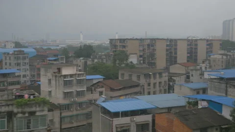 The train arrives in the city of Xi'an on a cloudy day, in China Stock Footage 232196193