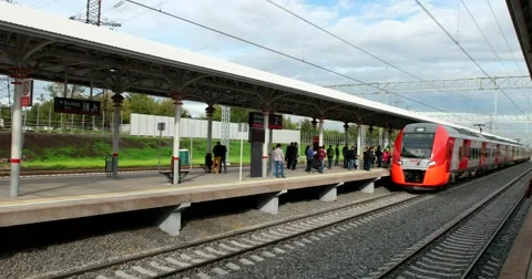The train arrives at the platform with passengers Stock Footage 67470260